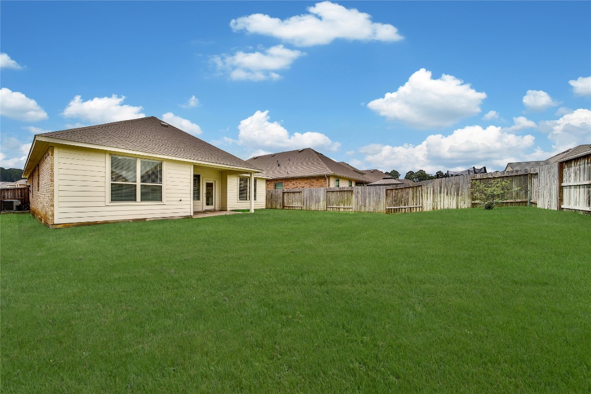 906 Youth Water Road Montgomery, TX 77316 - Photo 32 of 42 a front view of a house with a garden