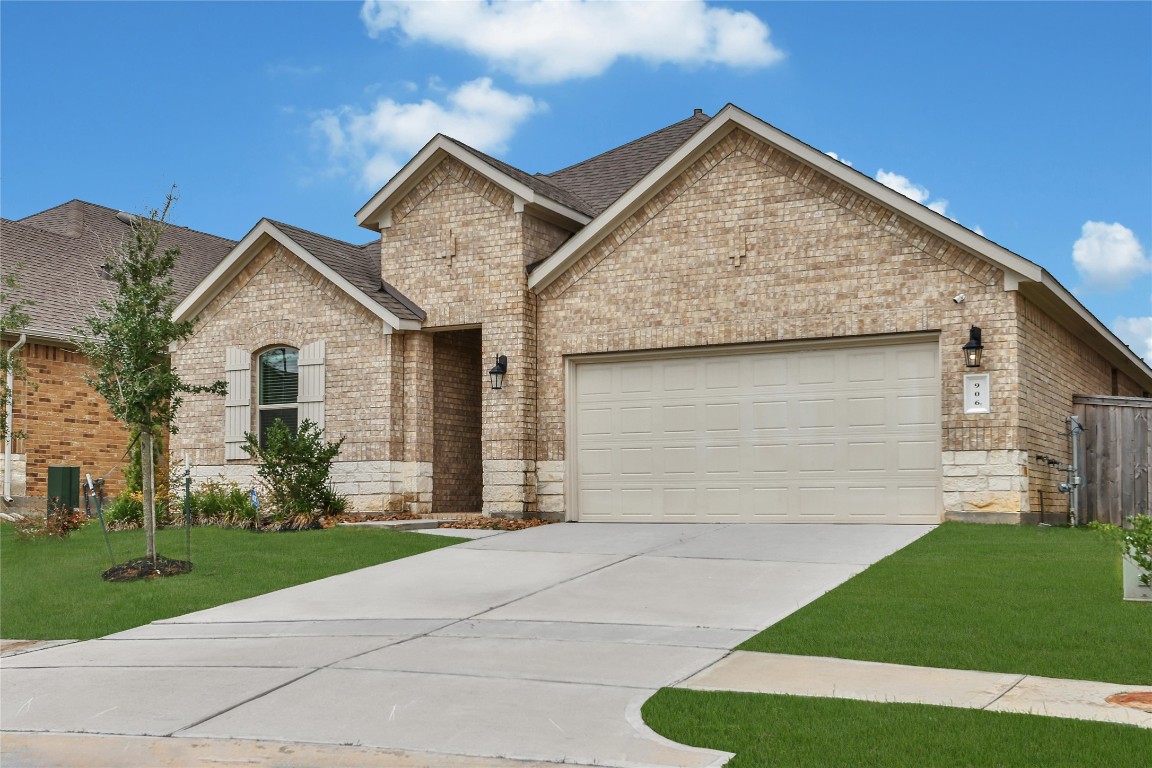 906 Youth Water Road Montgomery, TX 77316 - Photo 39 of 42 a front view of a house with a yard