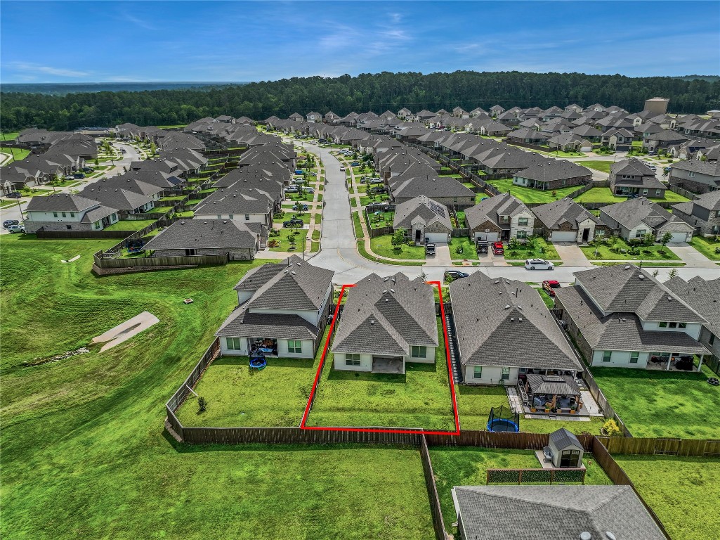 906 Youth Water Road Montgomery, TX 77316 - Photo 6 of 42 an aerial view of a house with a yard