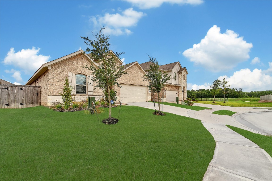 906 Youth Water Road Montgomery, TX 77316 - Photo 7 of 42 a view of a house with a backyard