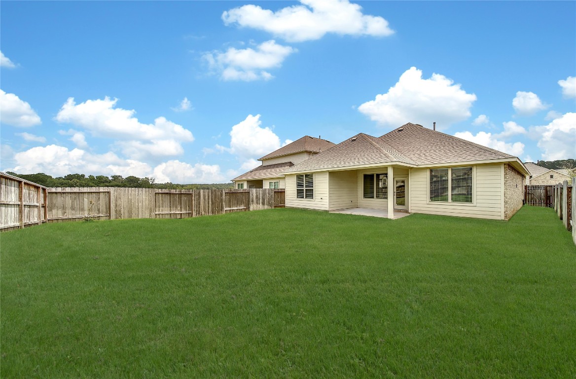 906 Youth Water Road Montgomery, TX 77316 - Photo 8 of 42 a view of a house with a yard and a garden