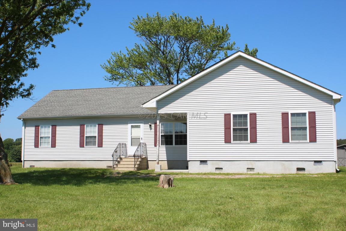 8133 Libertytown Road Berlin, MD 21811 - Photo 1 of 25 a front view of a house with a yard