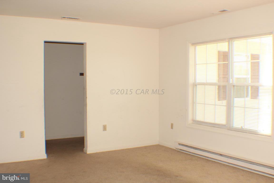 8133 Libertytown Road Berlin, MD 21811 - Photo 3 of 25 a view of an empty room with a window