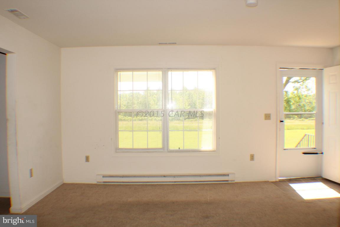 8133 Libertytown Road Berlin, MD 21811 - Photo 4 of 25 a view of an empty room with a window