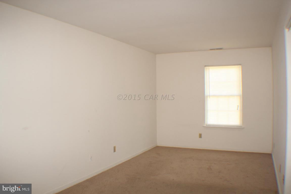 8133 Libertytown Road Berlin, MD 21811 - Photo 5 of 25 an empty room with a window