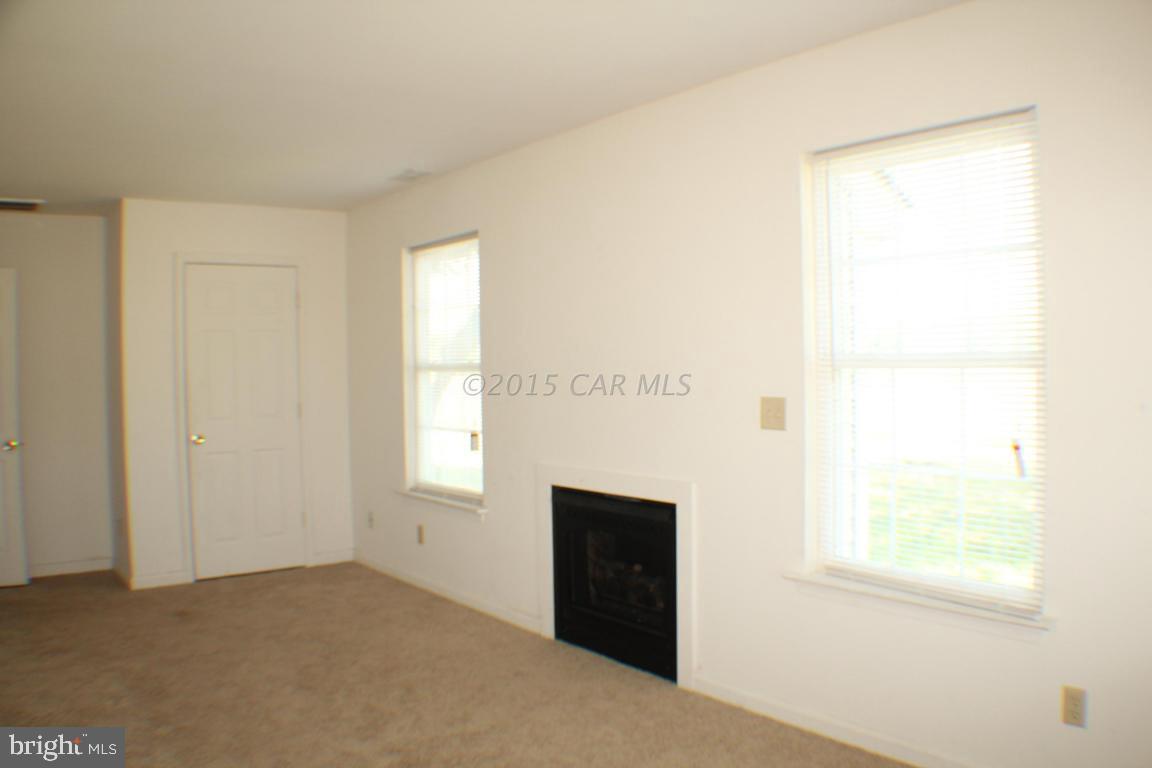 8133 Libertytown Road Berlin, MD 21811 - Photo 8 of 25 a view of an empty room with a window