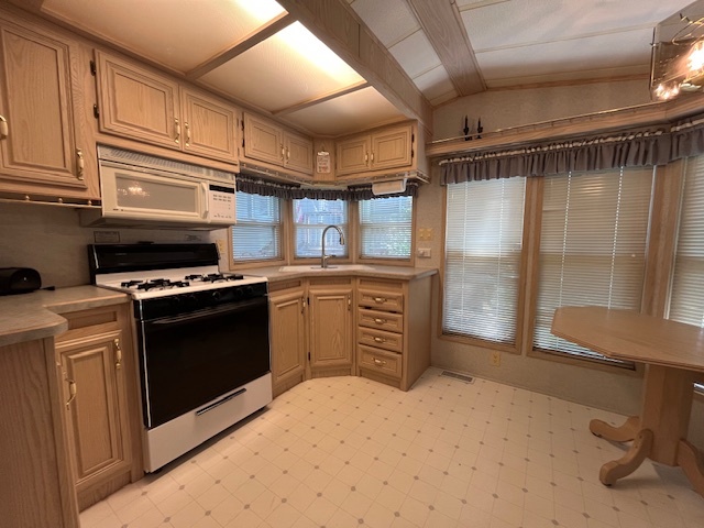 2795 East 28th Road Marseilles, IL 61341 - Photo 5 of 65 a kitchen with stainless steel appliances a stove and a refrigerator