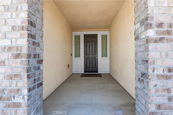 a view of an empty room with a door