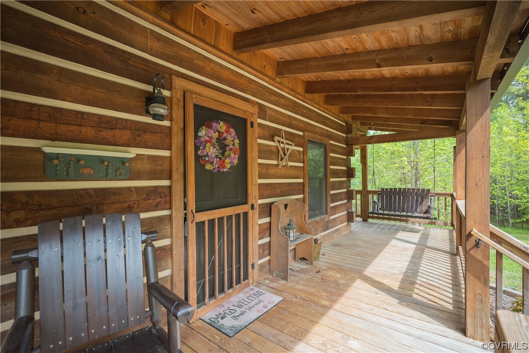 2095 Eureka Mill Road Keysville, VA 23947 - Photo 12 of 43 a view of a porch with wooden floor and windows