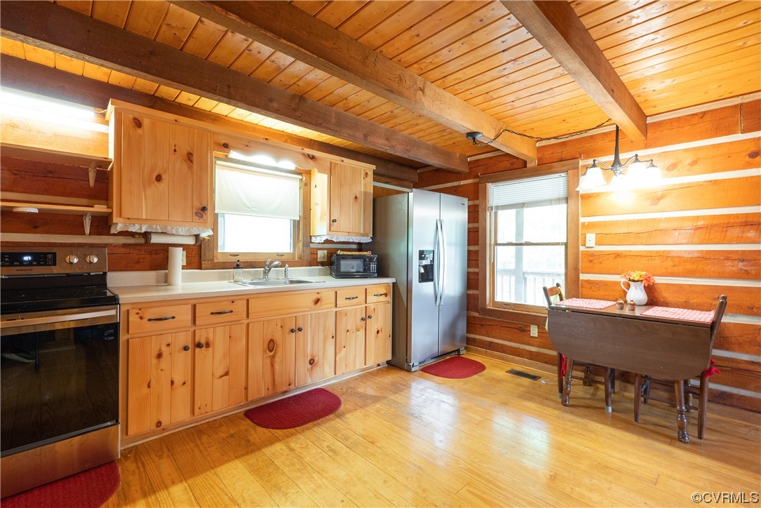 2095 Eureka Mill Road Keysville, VA 23947 - Photo 30 of 43 a large kitchen with a table and chairs