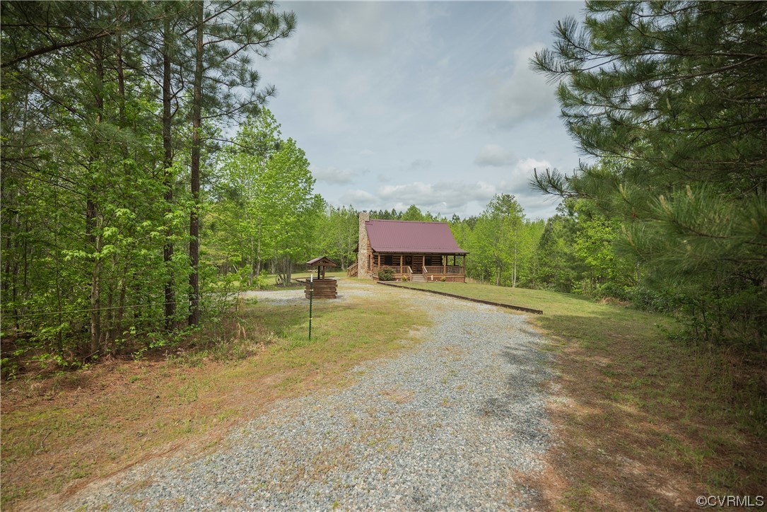 2095 Eureka Mill Road Keysville, VA 23947 - Photo 3 of 43 a swimming pool with trees in the background