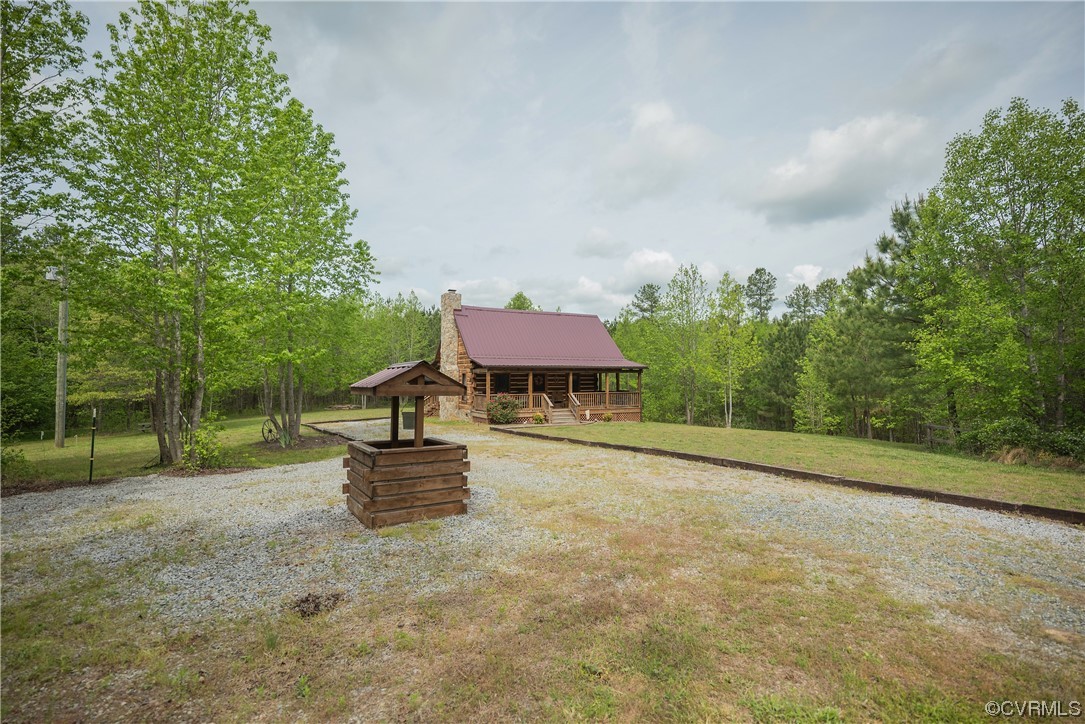 2095 Eureka Mill Road Keysville, VA 23947 - Photo 5 of 43 a backyard of a house with table and chairs