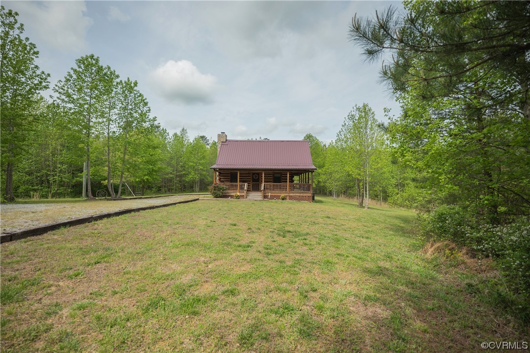 2095 Eureka Mill Road Keysville, VA 23947 - Photo 6 of 43 a backyard of a house with table and chairs