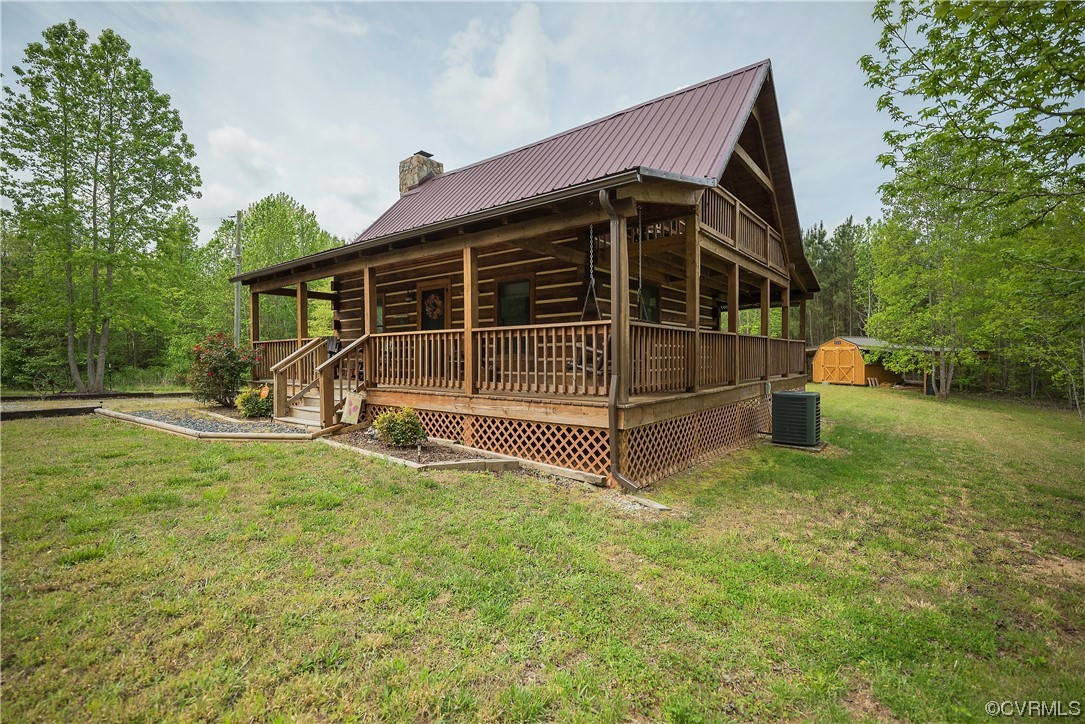 2095 Eureka Mill Road Keysville, VA 23947 - Photo 8 of 43 a view of backyard with wooden fence and a large tree