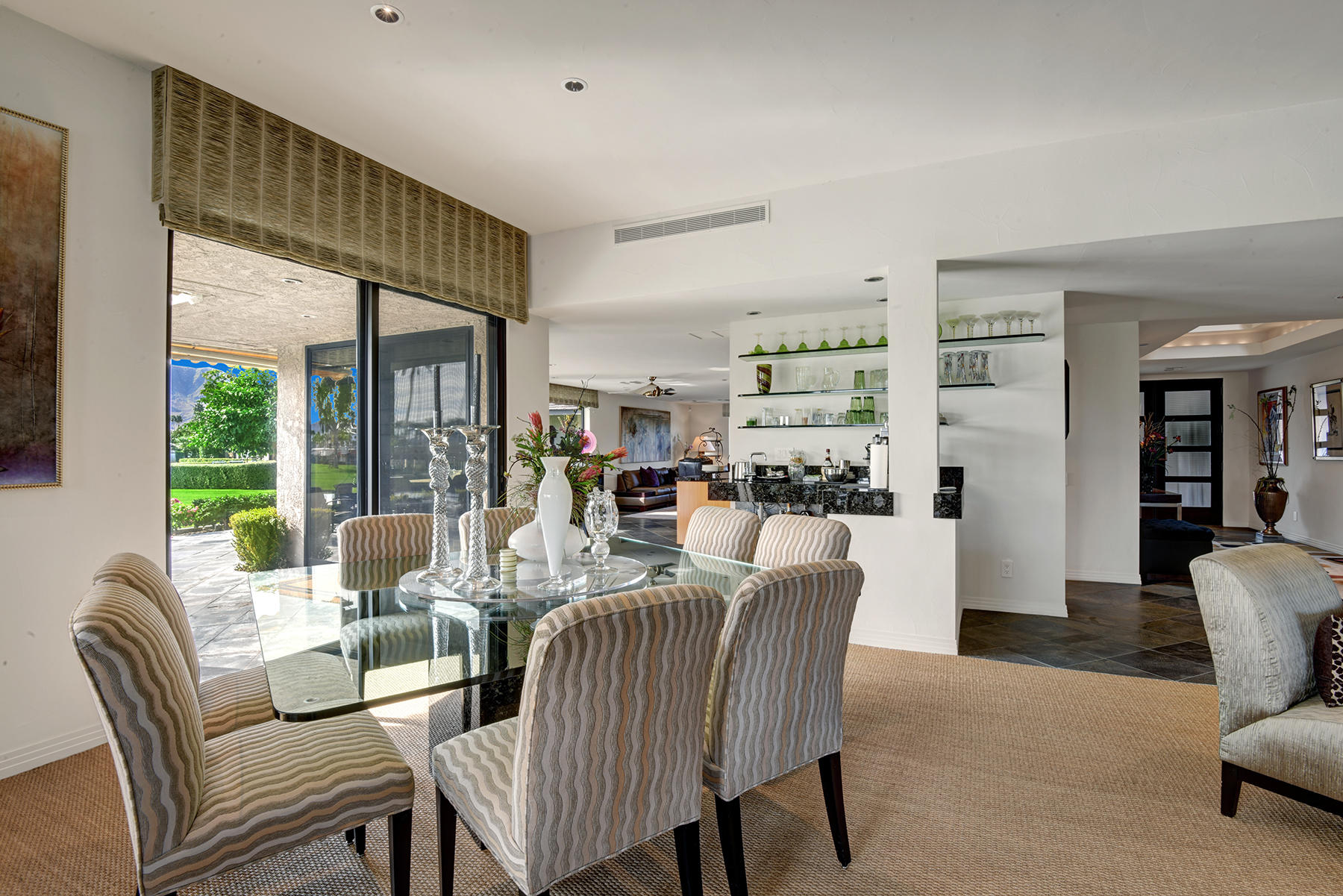 8 Rutgers Court Rancho Mirage, CA 92270 - Photo 20 of 57 a dining room with furniture a large window and a rug