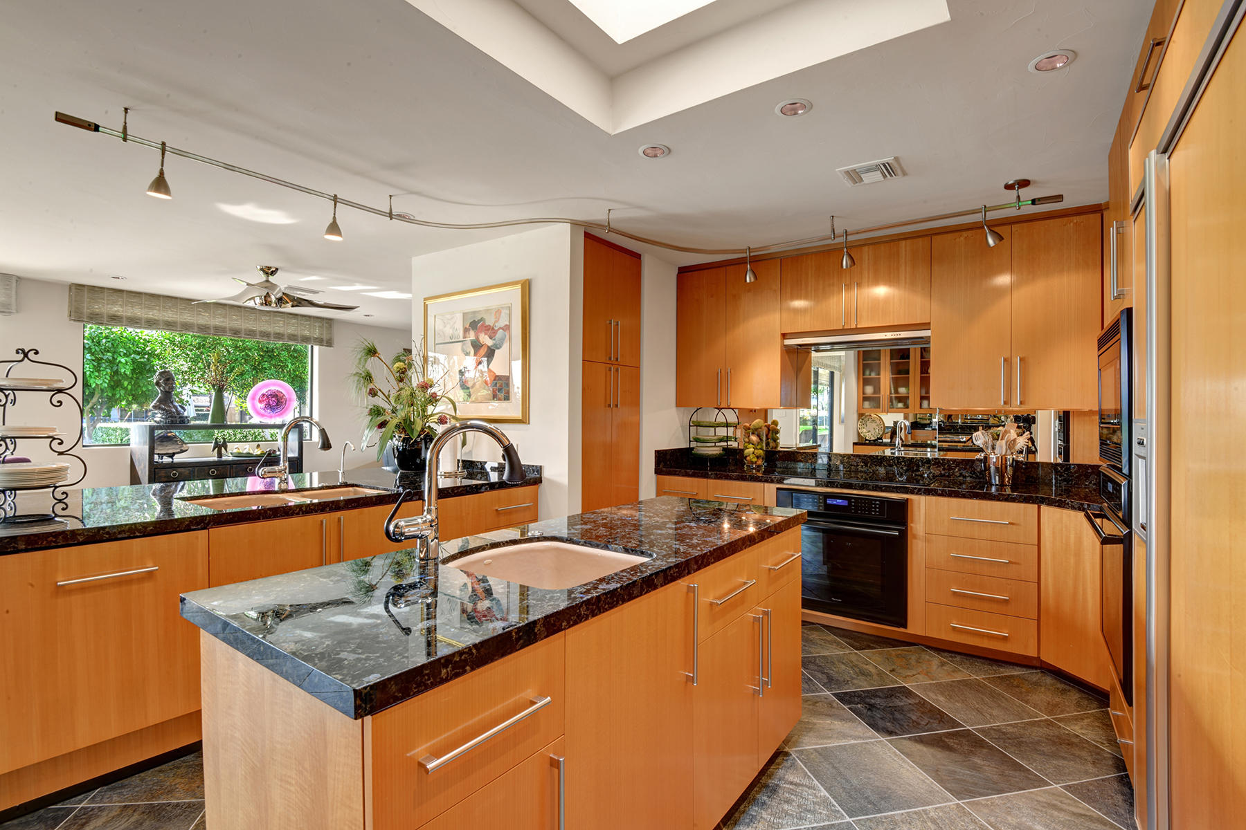 8 Rutgers Court Rancho Mirage, CA 92270 - Photo 23 of 57 a kitchen with stainless steel appliances granite countertop a sink and a stove