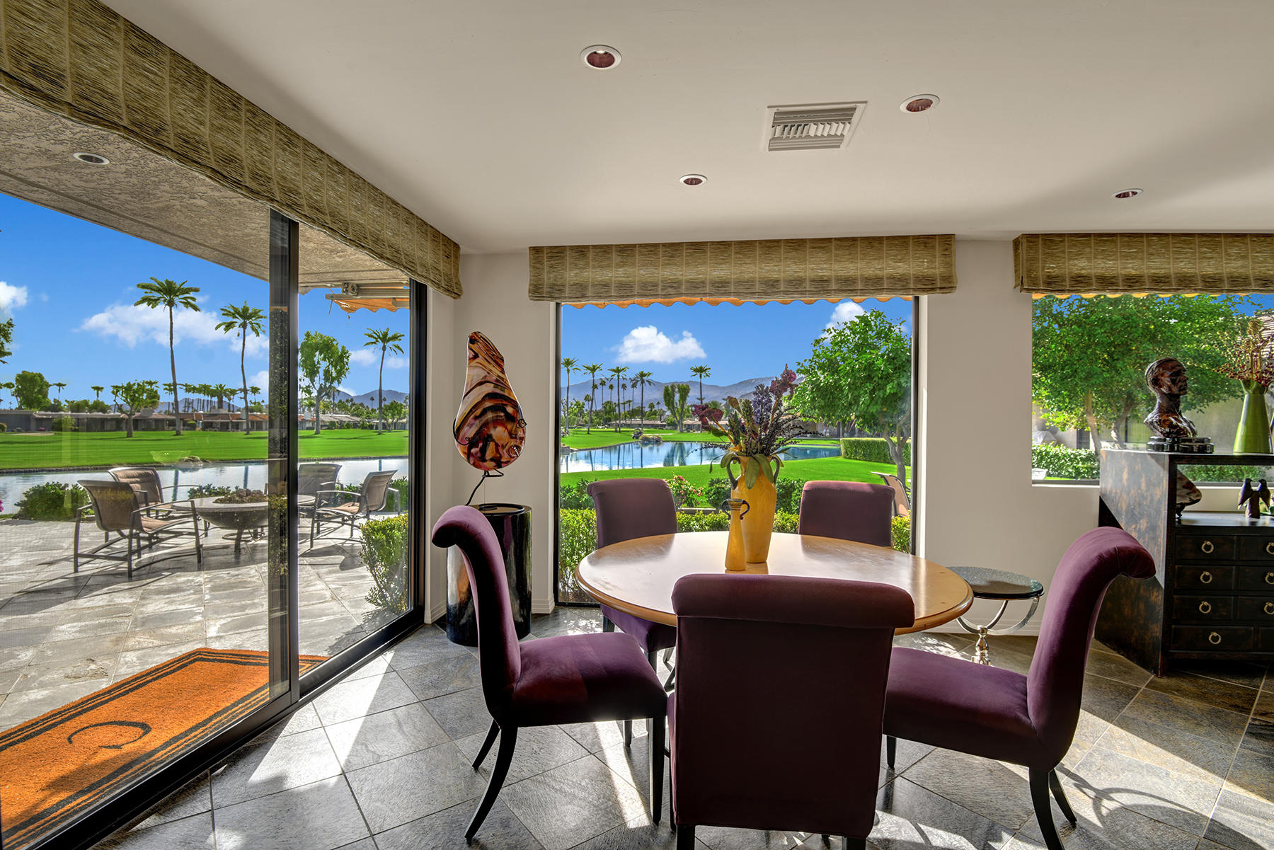 8 Rutgers Court Rancho Mirage, CA 92270 - Photo 27 of 57 a living room with furniture floor to ceiling window and a floor to ceiling window