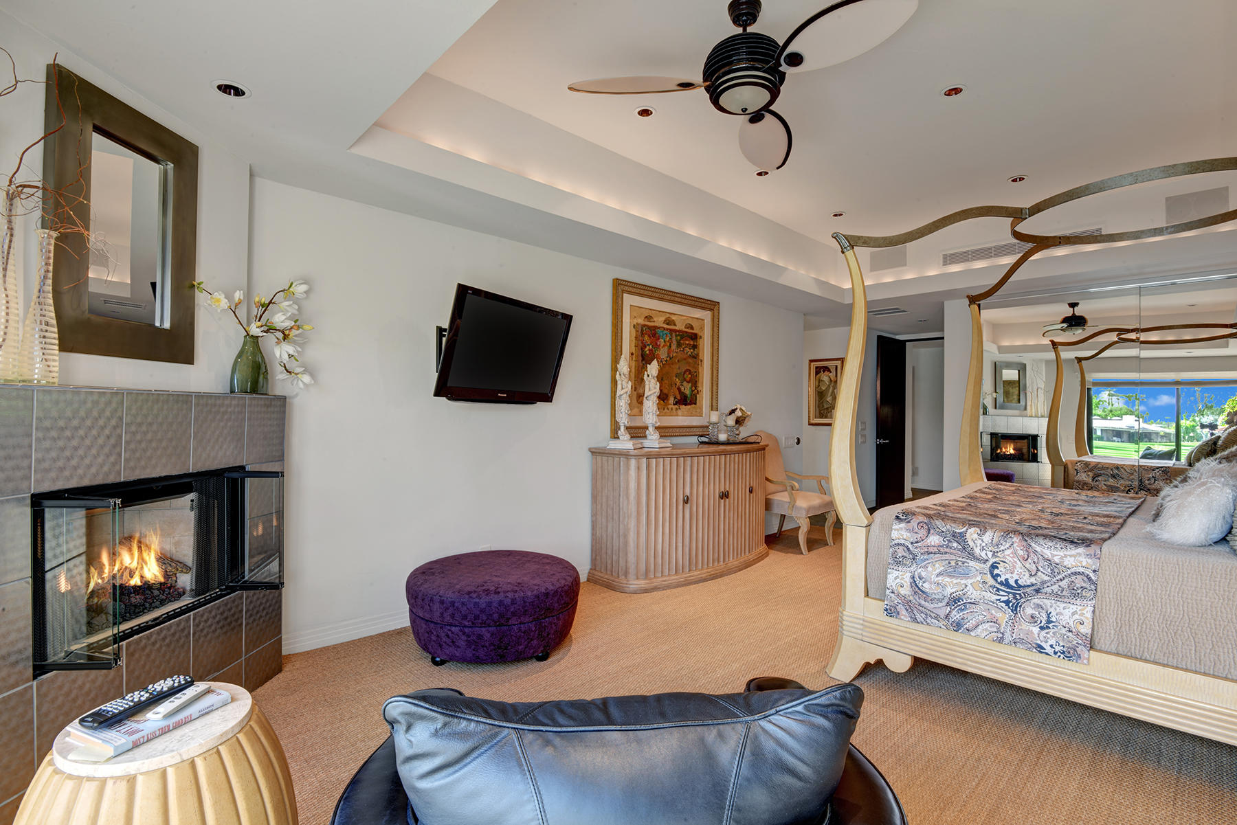 8 Rutgers Court Rancho Mirage, CA 92270 - Photo 31 of 57 a bedroom with furniture and a fireplace