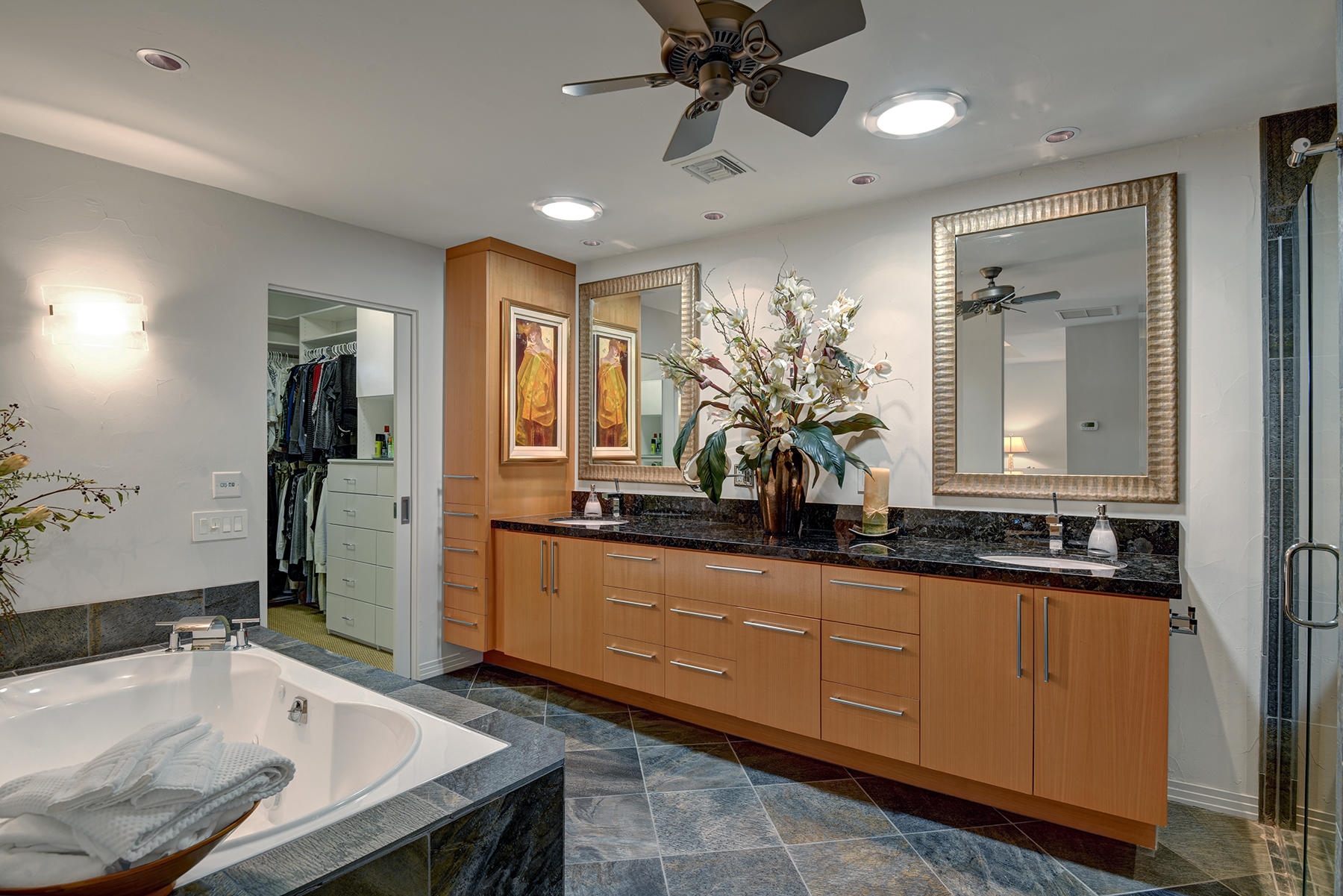 8 Rutgers Court Rancho Mirage, CA 92270 - Photo 35 of 57 a spacious bathroom with a granite countertop tub sink and mirror