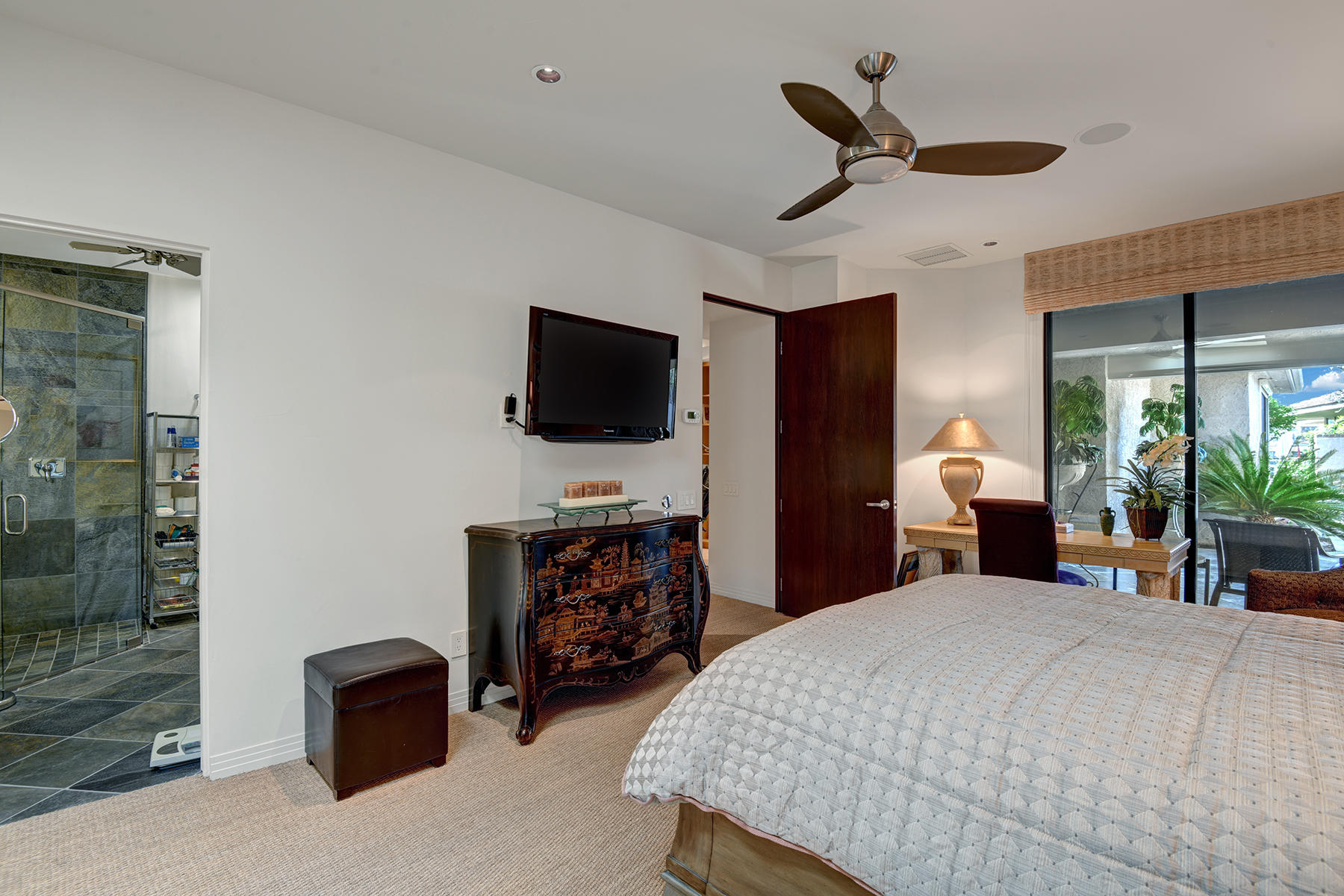 8 Rutgers Court Rancho Mirage, CA 92270 - Photo 39 of 57 a bedroom with a bed and a television