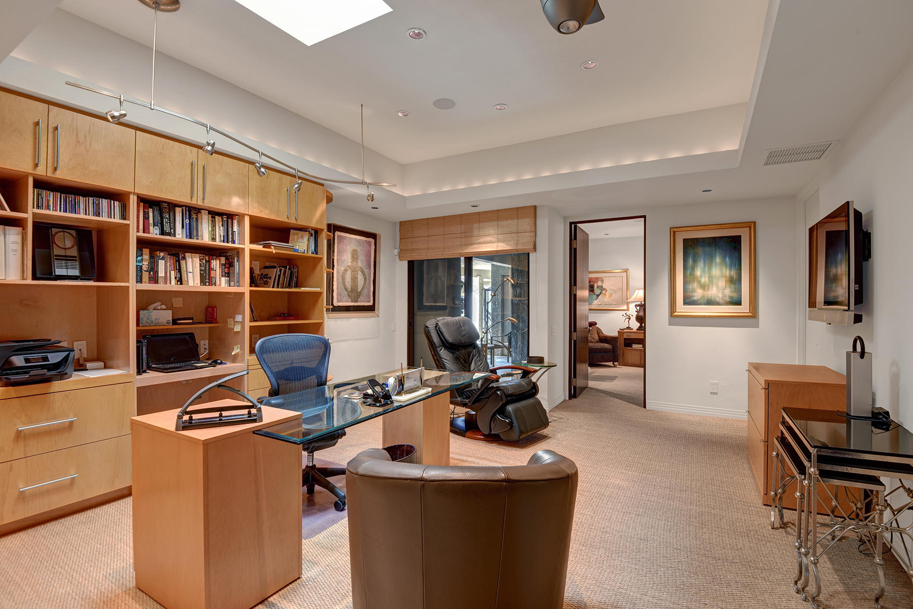 8 Rutgers Court Rancho Mirage, CA 92270 - Photo 41 of 57 a work room with furniture a bookshelf and a window