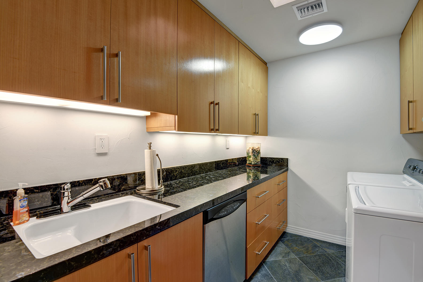 8 Rutgers Court Rancho Mirage, CA 92270 - Photo 44 of 57 a kitchen with a sink and cabinets