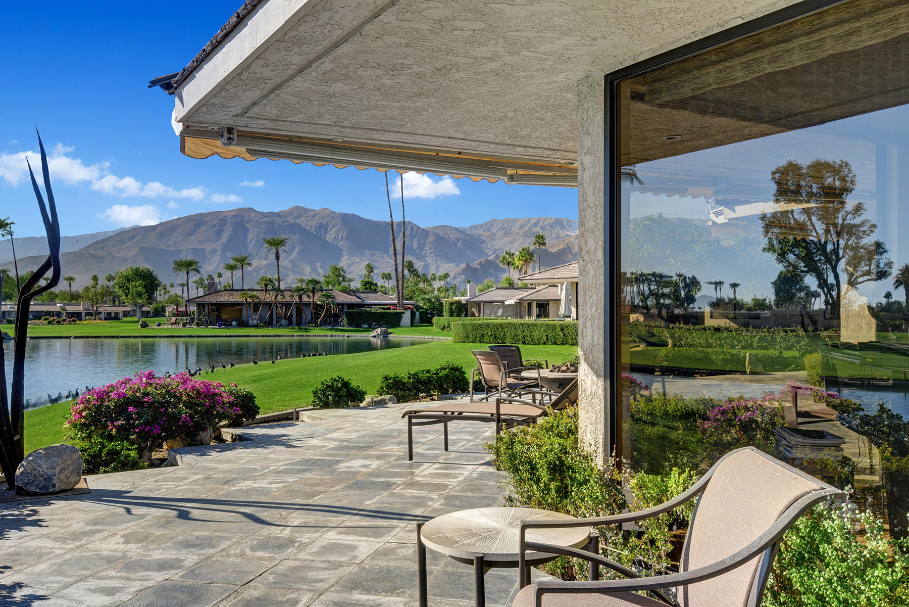 8 Rutgers Court Rancho Mirage, CA 92270 - Photo 47 of 57 a patio with a yard table and chairs