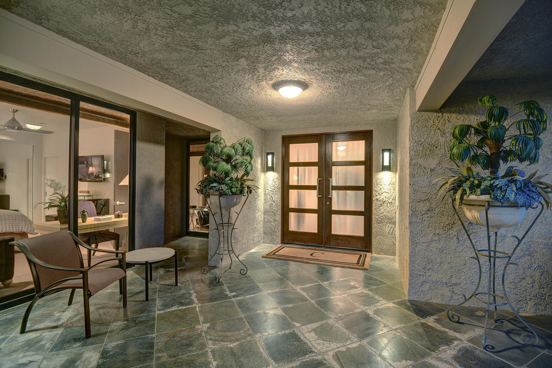 8 Rutgers Court Rancho Mirage, CA 92270 - Photo 54 of 57 a view of an entryway with table and chairs