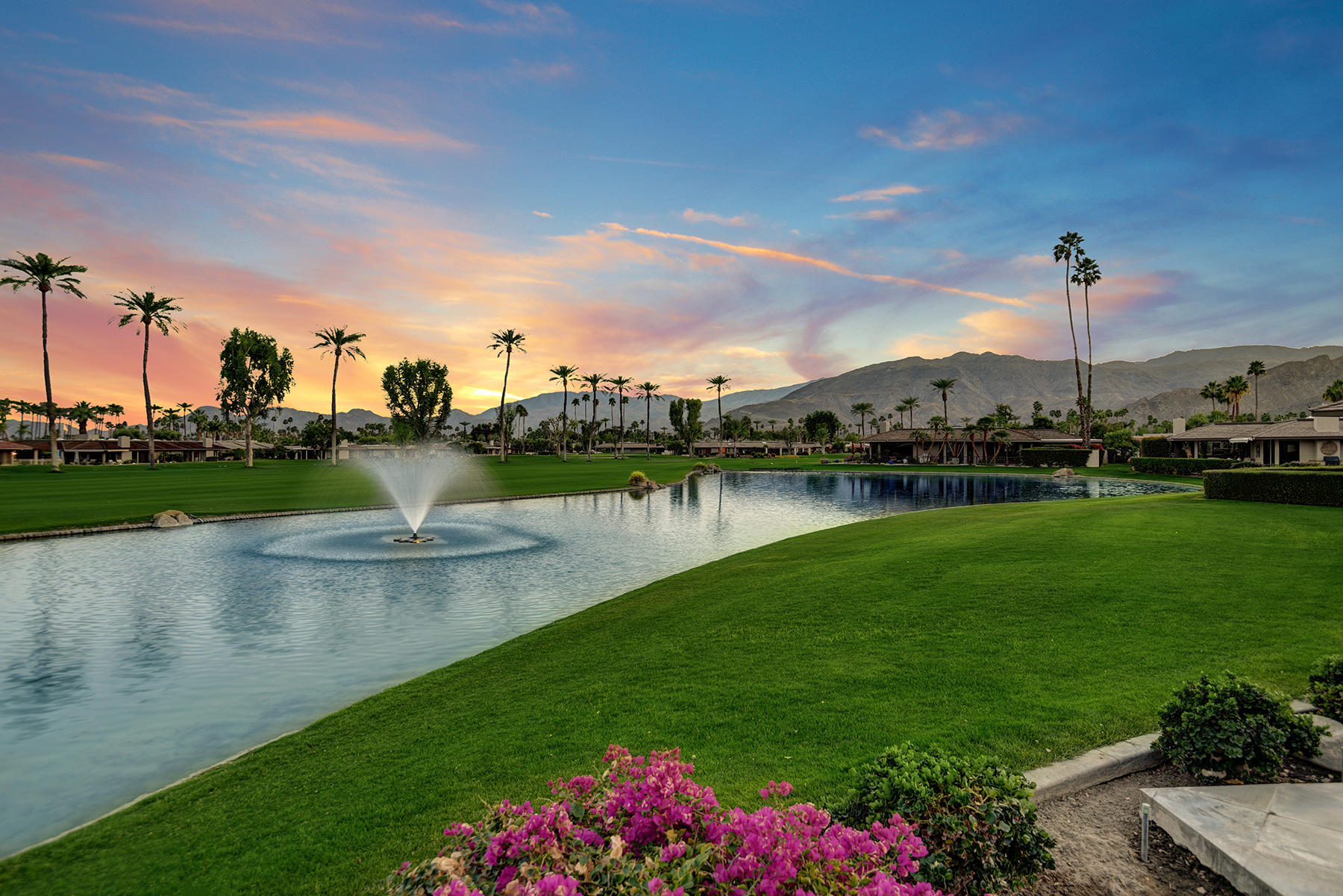 8 Rutgers Court Rancho Mirage, CA 92270 - Photo 56 of 57 a view of a lake with houses in the back