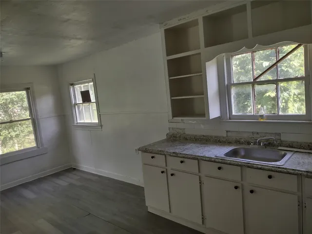 a kitchen with a sink and cabinets