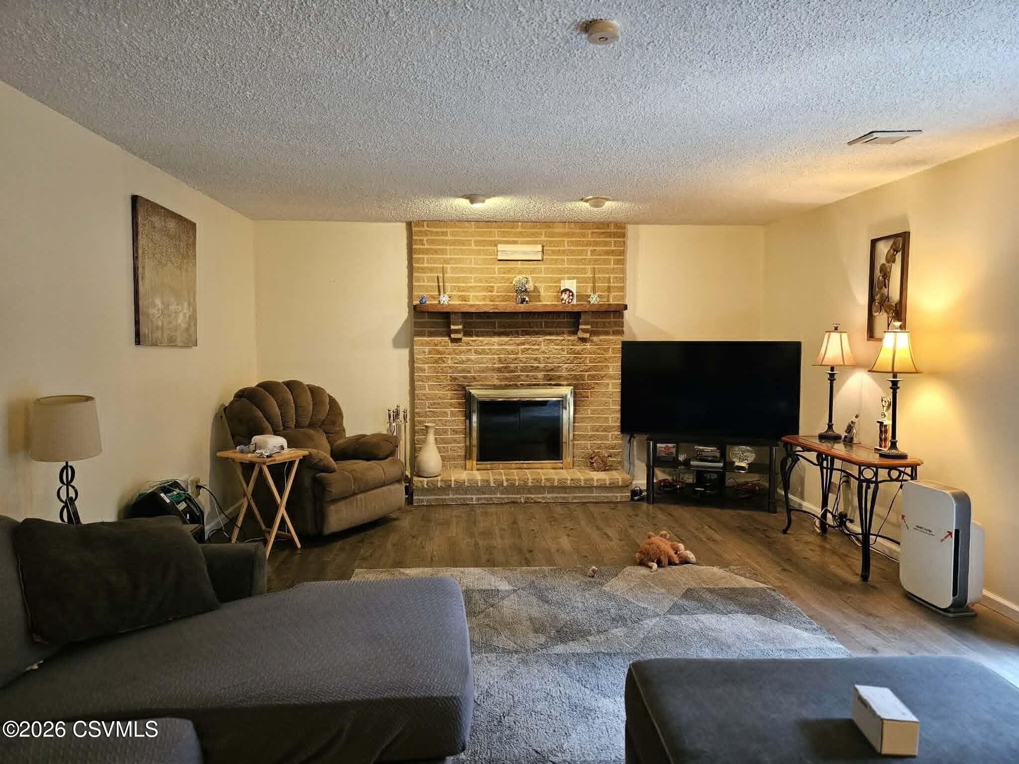 164 Crocus Road Sunbury, PA 17801 - Photo 24 of 38 a living room with furniture and a flat screen tv