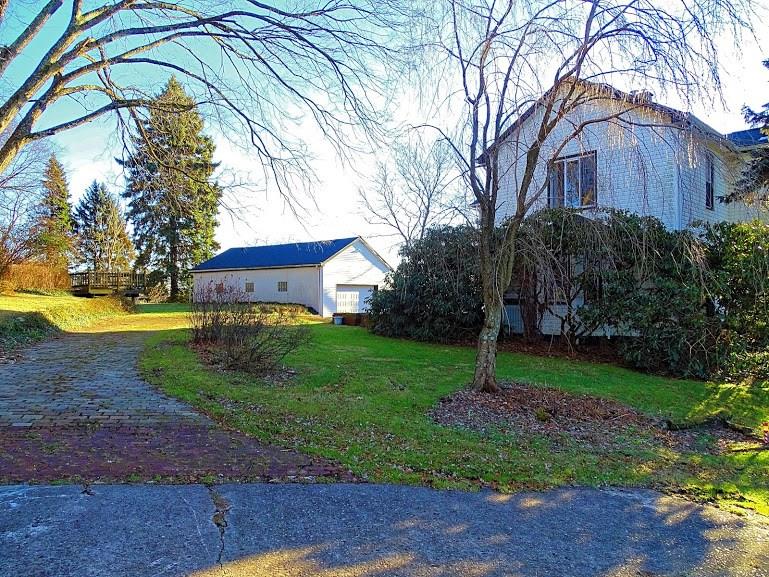 365 Foster Road North Versailles, PA 15137 - Photo 22 of 24 Left side of the home. The landscape includes mature fruit trees, berry bushes and flora.