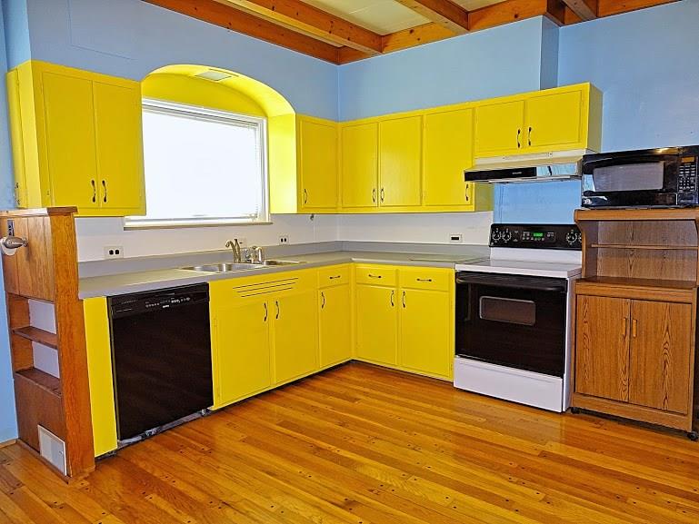 365 Foster Road North Versailles, PA 15137 - Photo 8 of 24 This bright kitchen has hardwood floors and exposed pine beams on the ceiling.