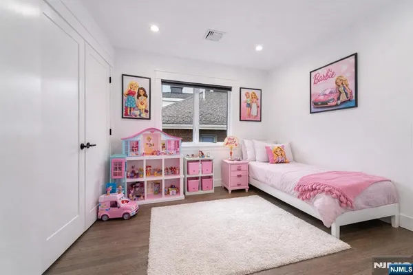 a bedroom with bed and a window