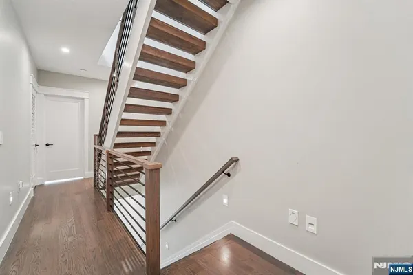 a view of entryway with wooden floor