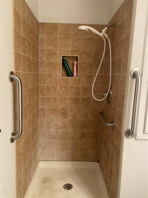 808 North Hughes Street Howe, TX 75459 - Photo 16 of 19 a bathroom with a shower