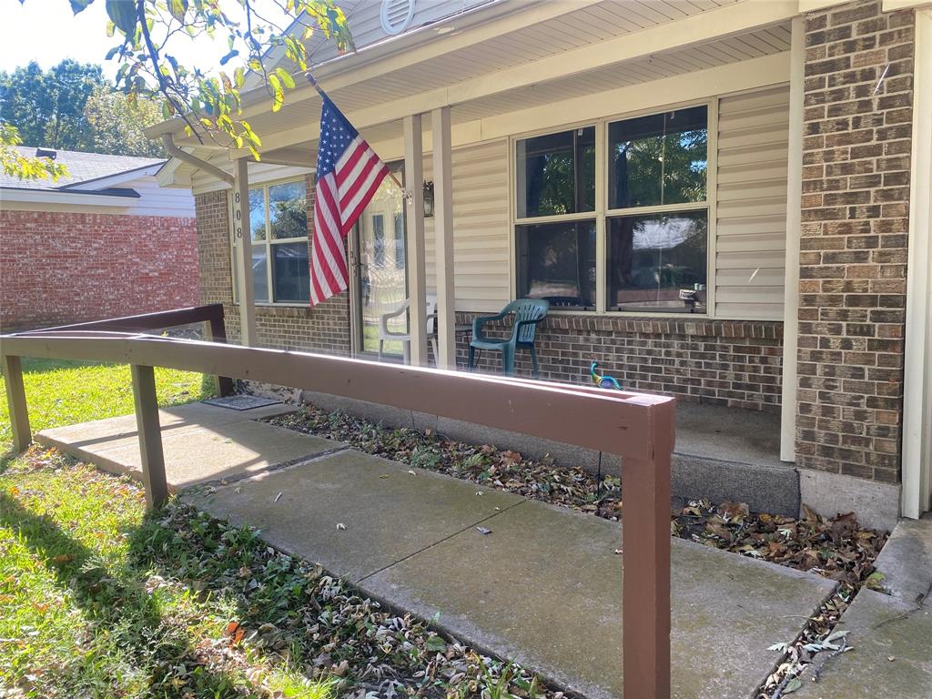 808 North Hughes Street Howe, TX 75459 - Photo 5 of 19 a view of building with wooden floor and outdoor seating