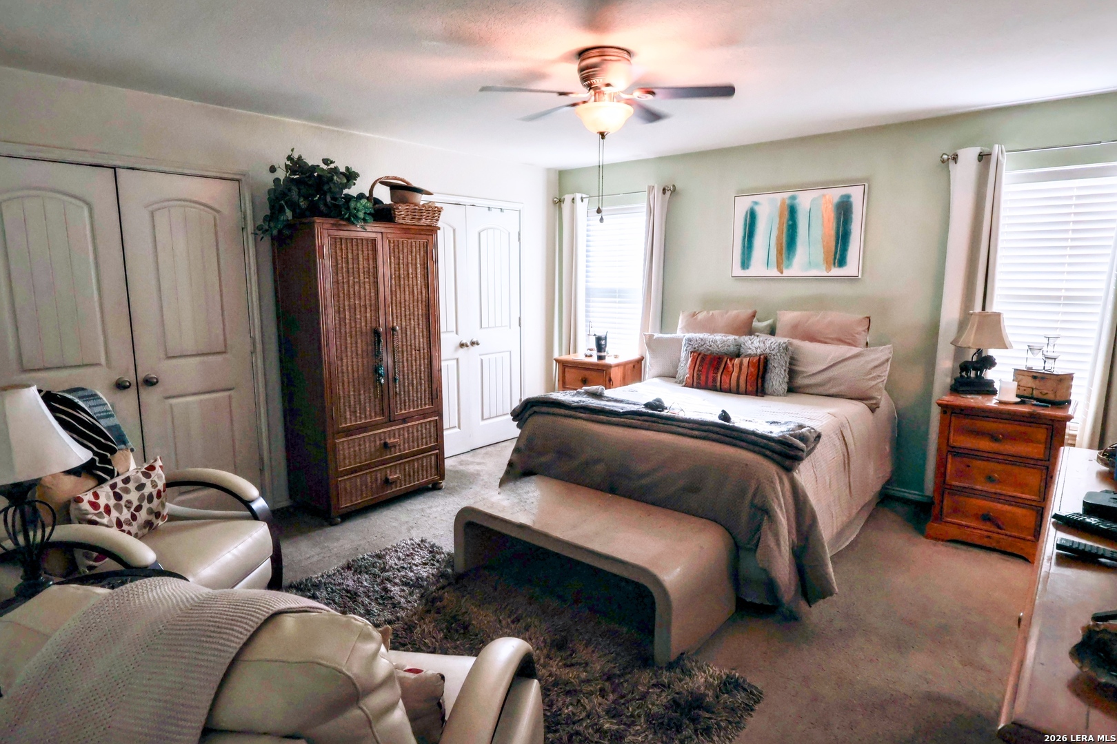 9927 Hawk Village Converse, TX 78109 - Photo 13 of 25 a bedroom with furniture and a window