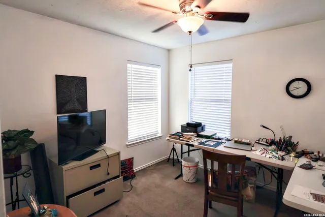 a view of a livingroom with furniture and a flat screen tv