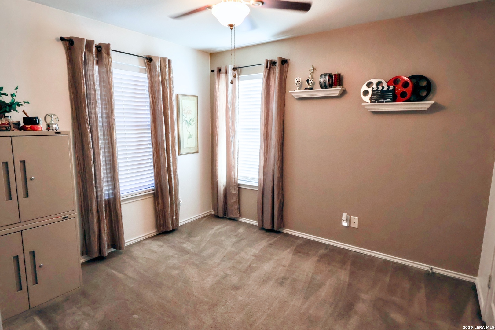 9927 Hawk Village Converse, TX 78109 - Photo 17 of 25 a view of an empty room with a window and refrigerator