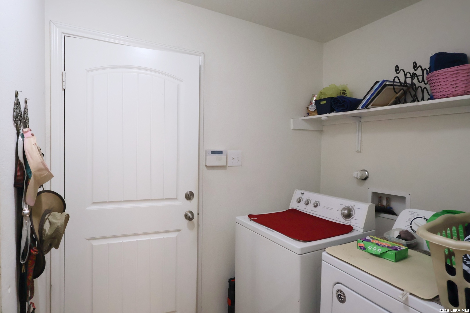 9927 Hawk Village Converse, TX 78109 - Photo 18 of 25 a room with storage and utility