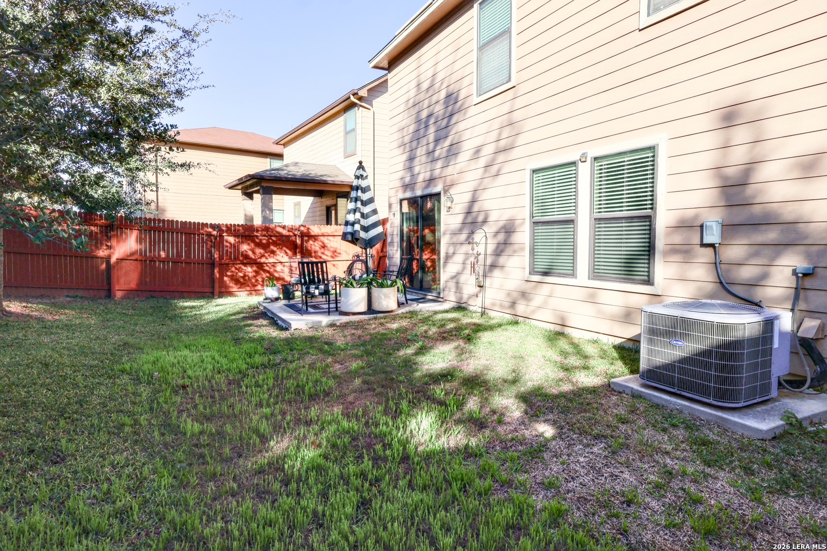 9927 Hawk Village Converse, TX 78109 - Photo 23 of 25 a view of a house with a backyard and sitting area