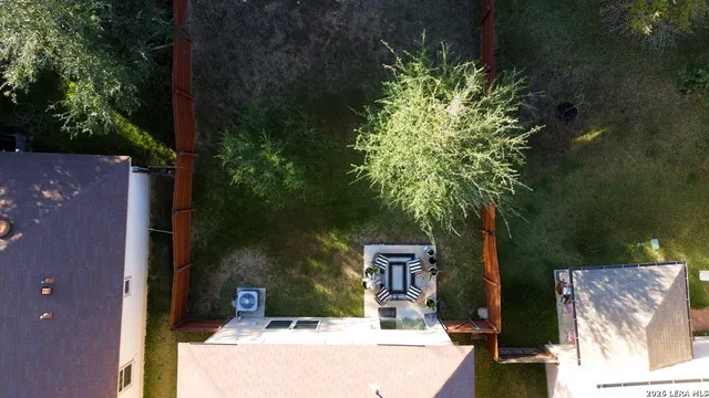 aerial view of a house with a yard