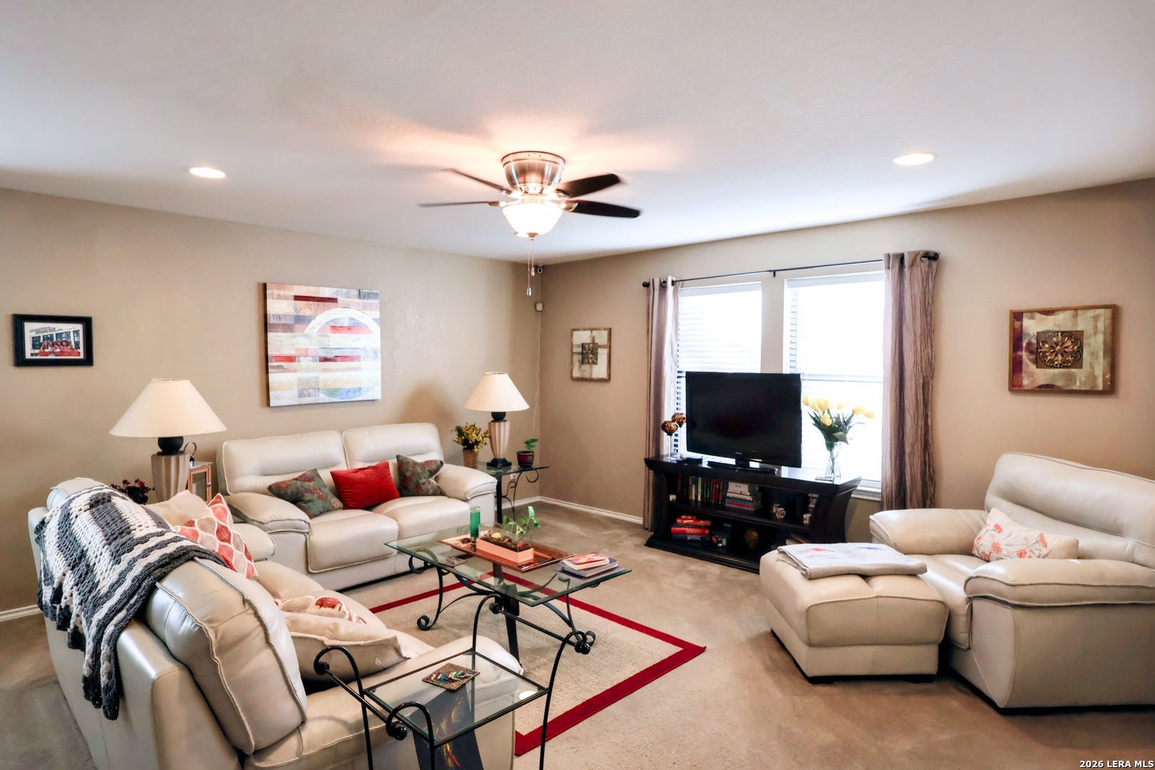 9927 Hawk Village Converse, TX 78109 - Photo 4 of 25 a living room with furniture and a flat screen tv