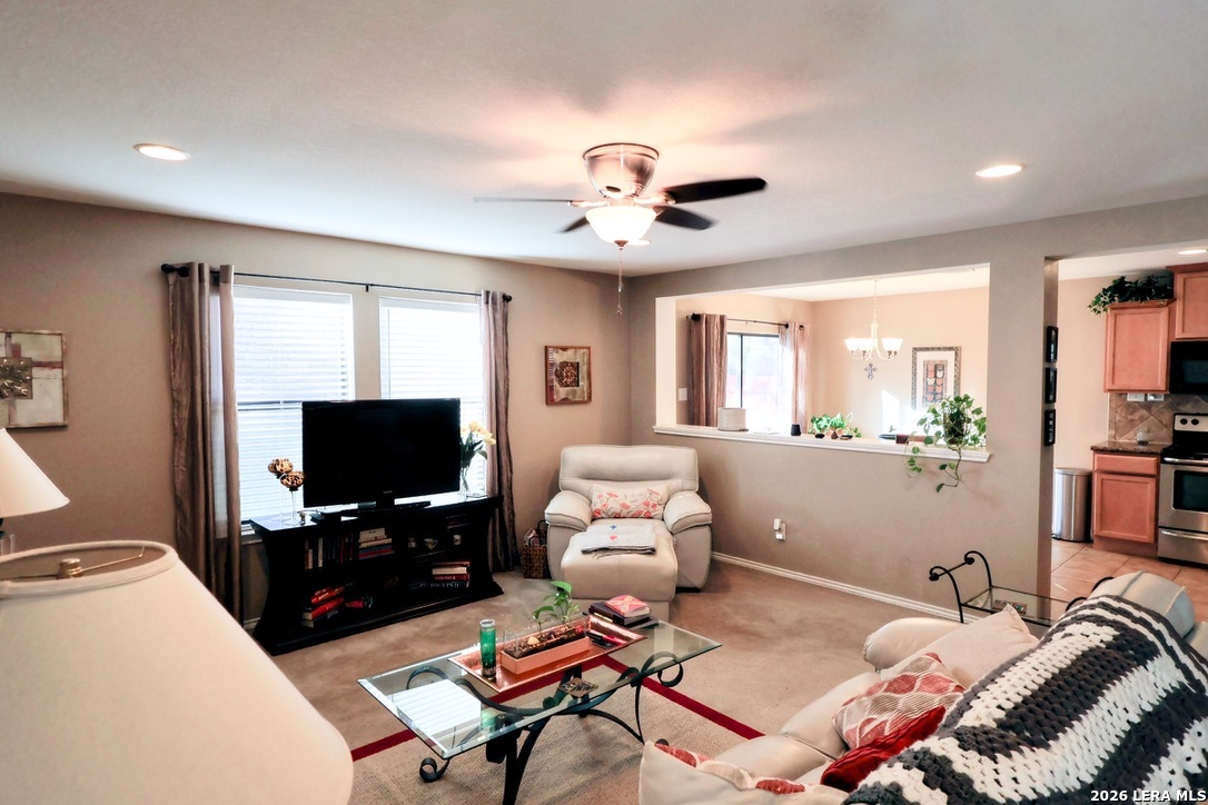 9927 Hawk Village Converse, TX 78109 - Photo 5 of 25 a living room with furniture and a flat screen tv