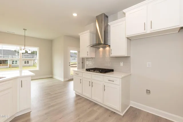 a bathroom with a window and a shower