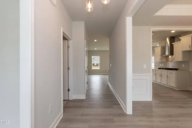 a view of a kitchen and a refrigerator