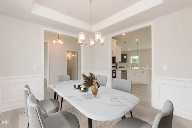 a view of an empty room with a window and fireplace