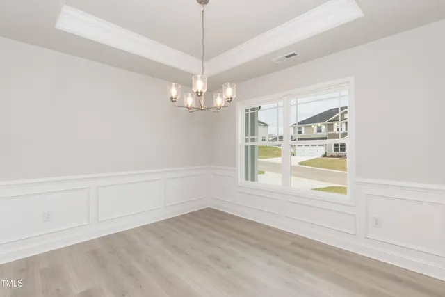a kitchen with stainless steel appliances white cabinets and a stove