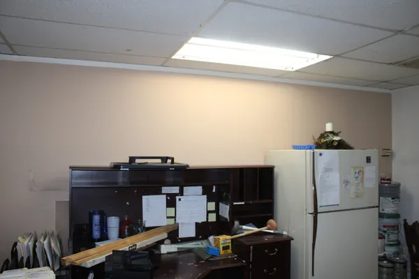a kitchen with a refrigerator and a stove